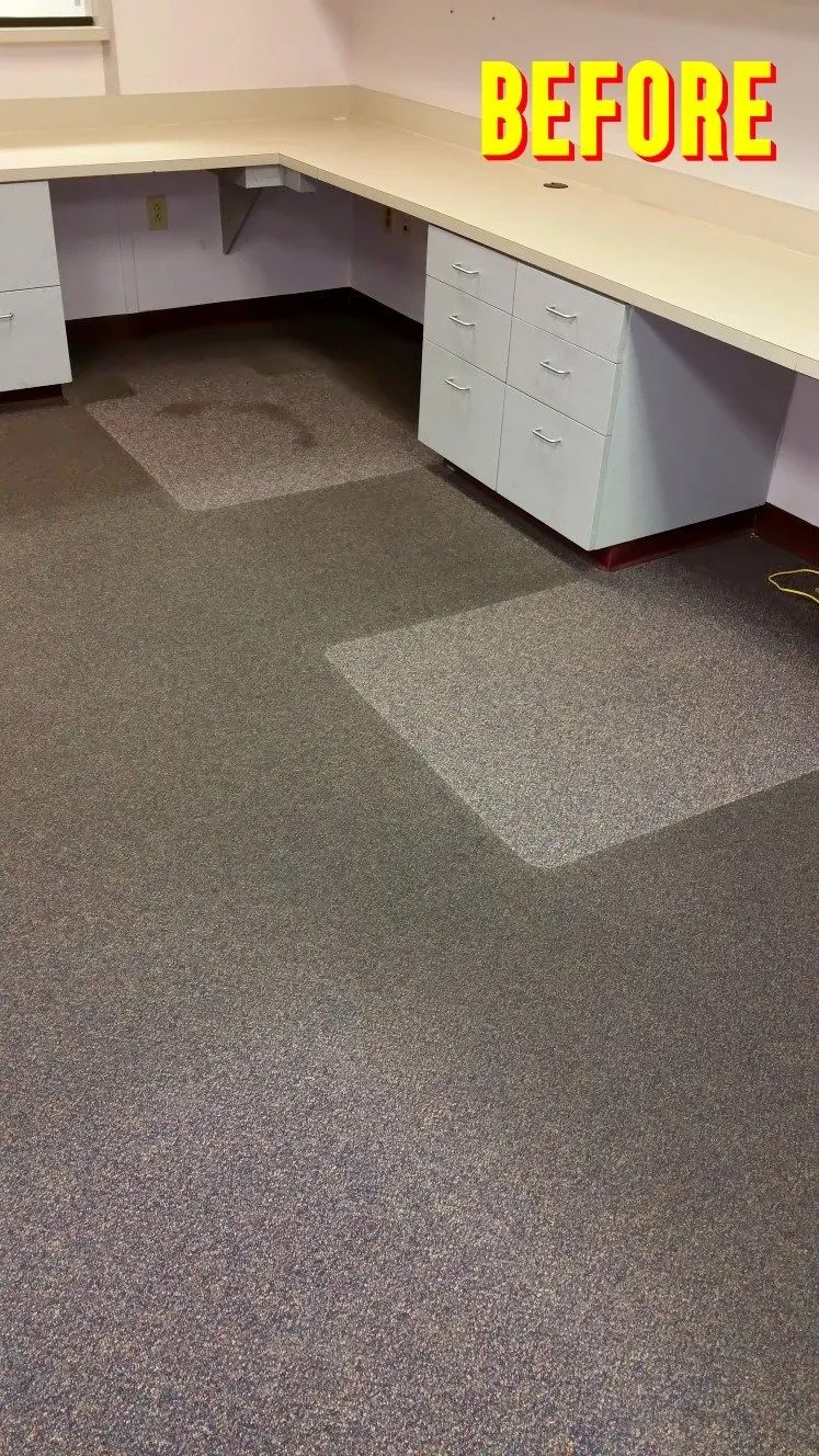 A before picture of an office with a desk and carpet