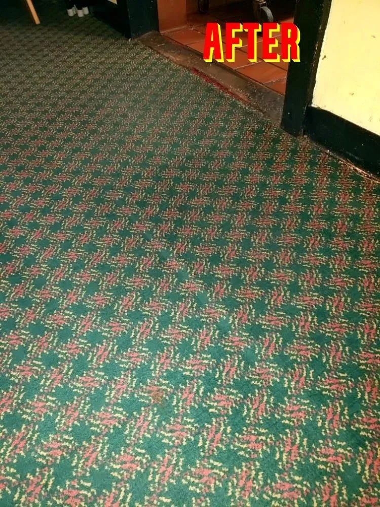 A picture of a green and red carpet with the caption after