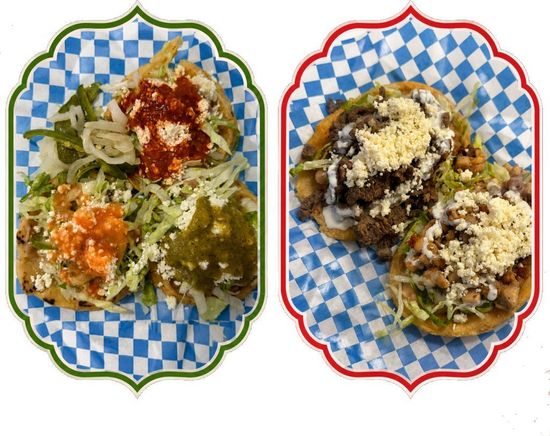Two plated servings of sauced pasta, one green-rimmed plate and one red-rimmed plate