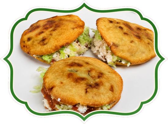 Three golden fried pastries with creamy filling on a white background