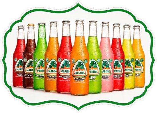 Assorted colorful beverage bottles arranged in a row within a green decorative border