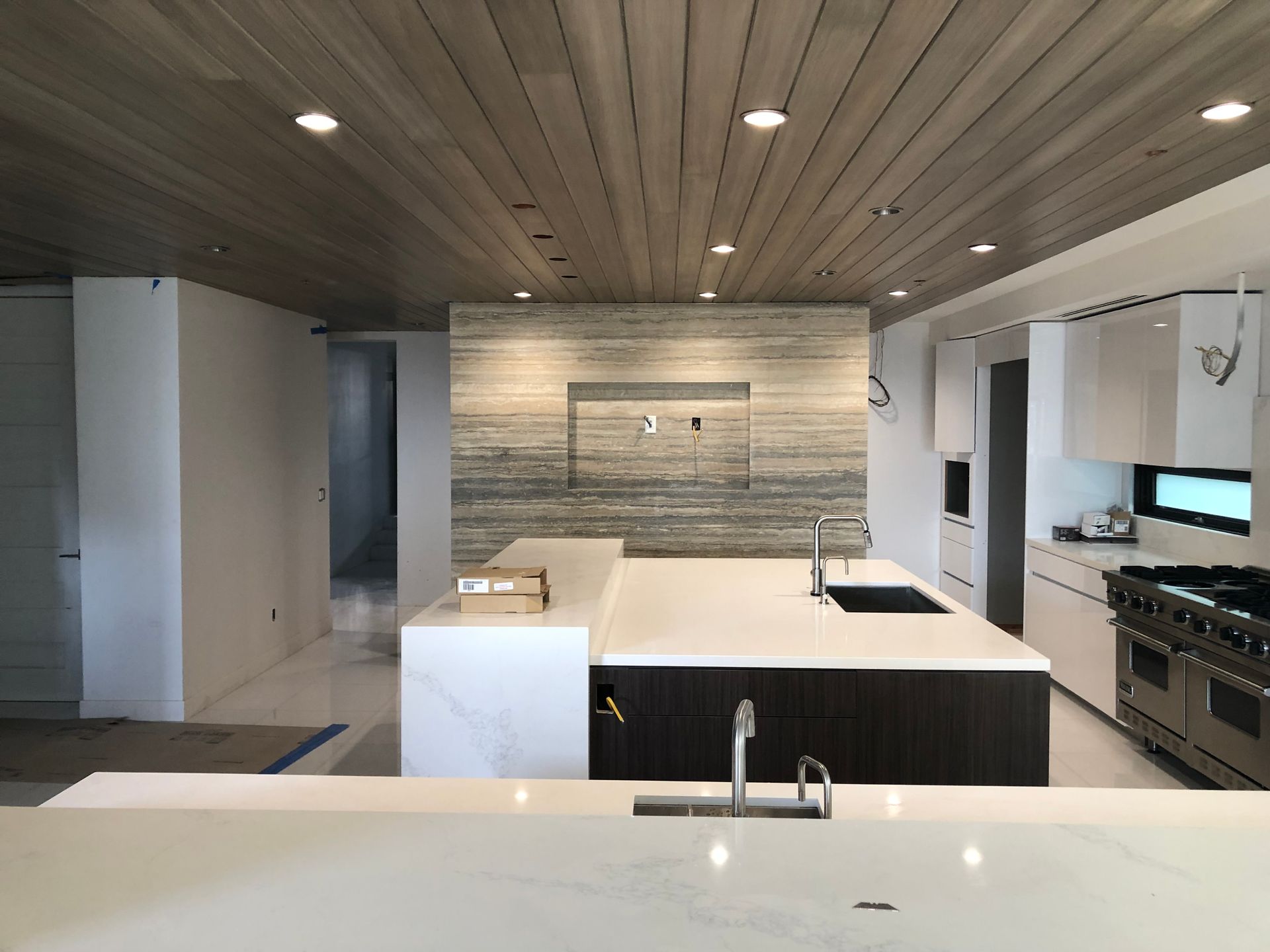 A kitchen with a large island in the middle of it