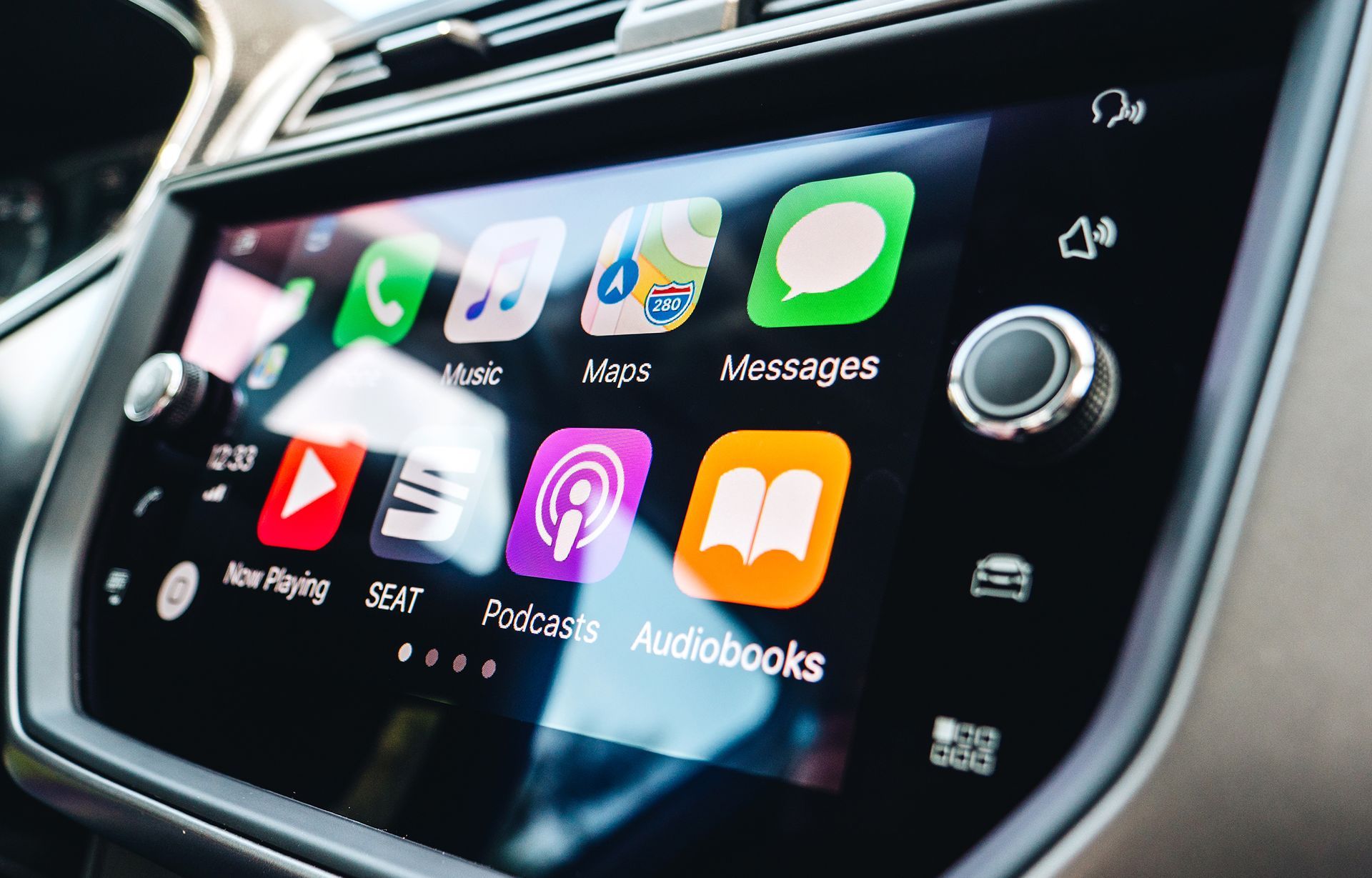 A car dashboard with a screen that says audiobooks on it.