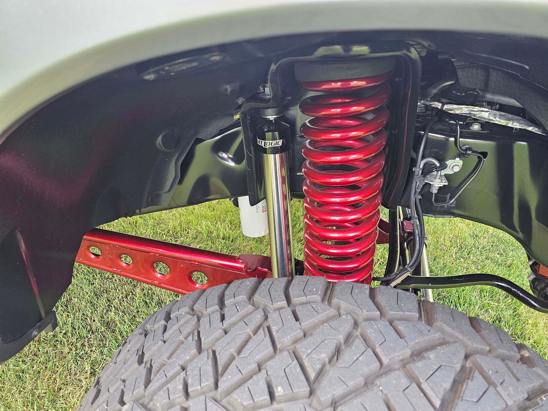 A close up of a suspension system on a truck