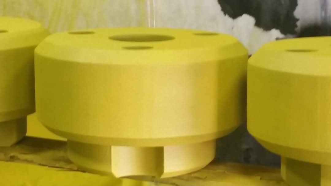 A bunch of yellow objects are sitting on a table.