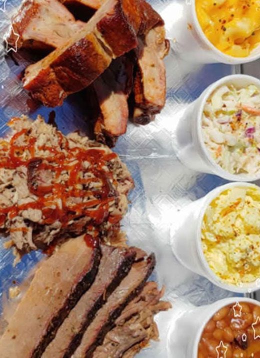 Barbecue platter: ribs, pulled pork, brisket, mac & cheese, coleslaw, potato salad, baked beans.