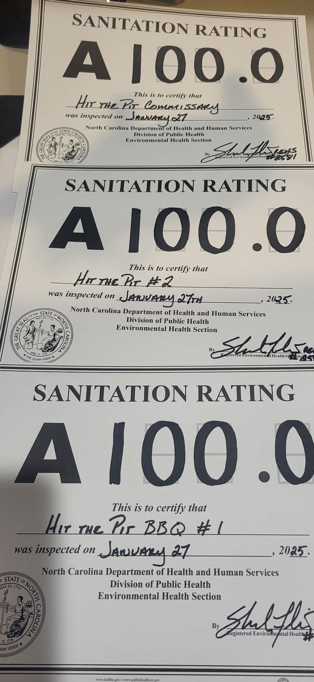 Three sanitation rating cards, each with an 