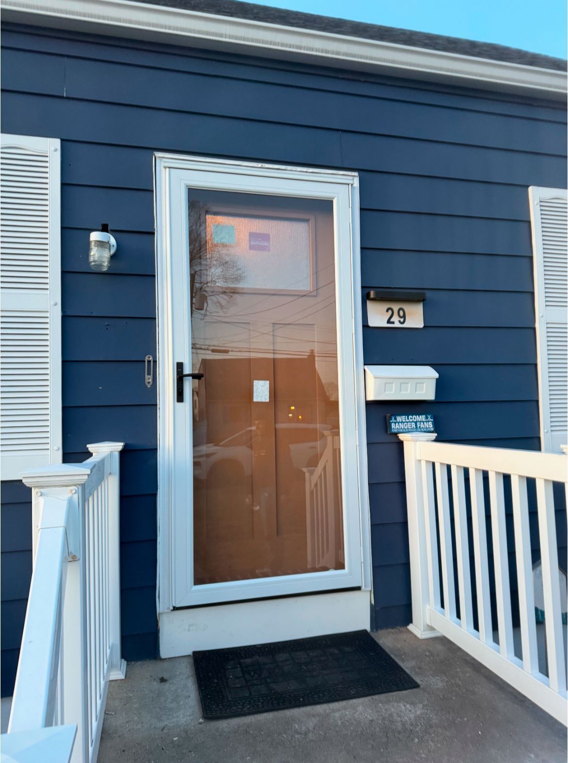 A blue house with newly installed door