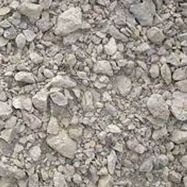 A pile of gravel is sitting on the ground.