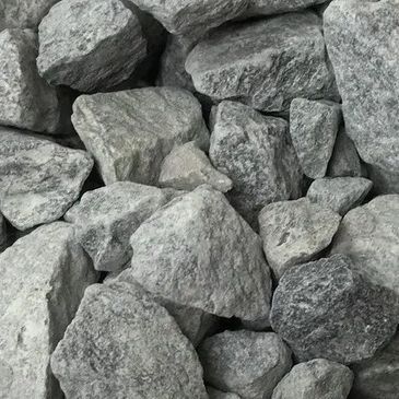 A pile of rocks is sitting on top of each other on a table.