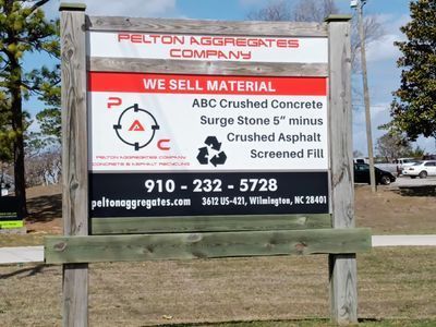 A sign that says pelton aggregates company on it