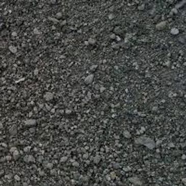 A close up of a pile of black gravel.