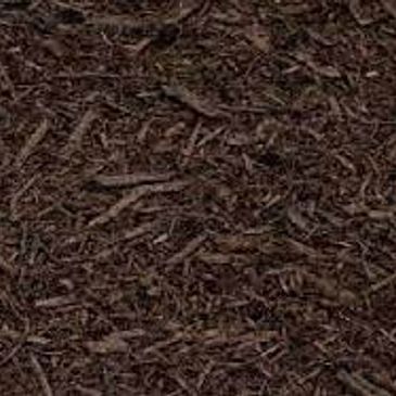 A close up of a pile of brown mulch.