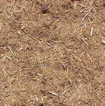 A close up of a pile of brown mulch.