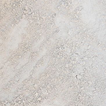 A close up of a pile of white powder on a table.