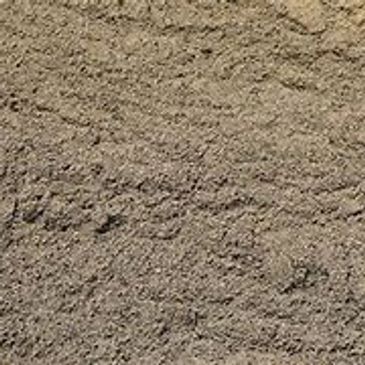 A close up of a pile of dirt on a table.
