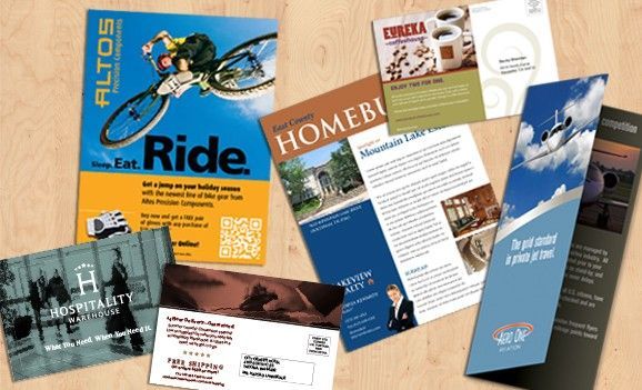 A bunch of brochures on a table including one that says ride