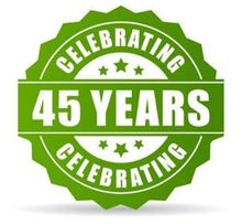 Green celebratory badge with “45 YEARS” in white text and stars, surrounded by “CELEBRATING” banners