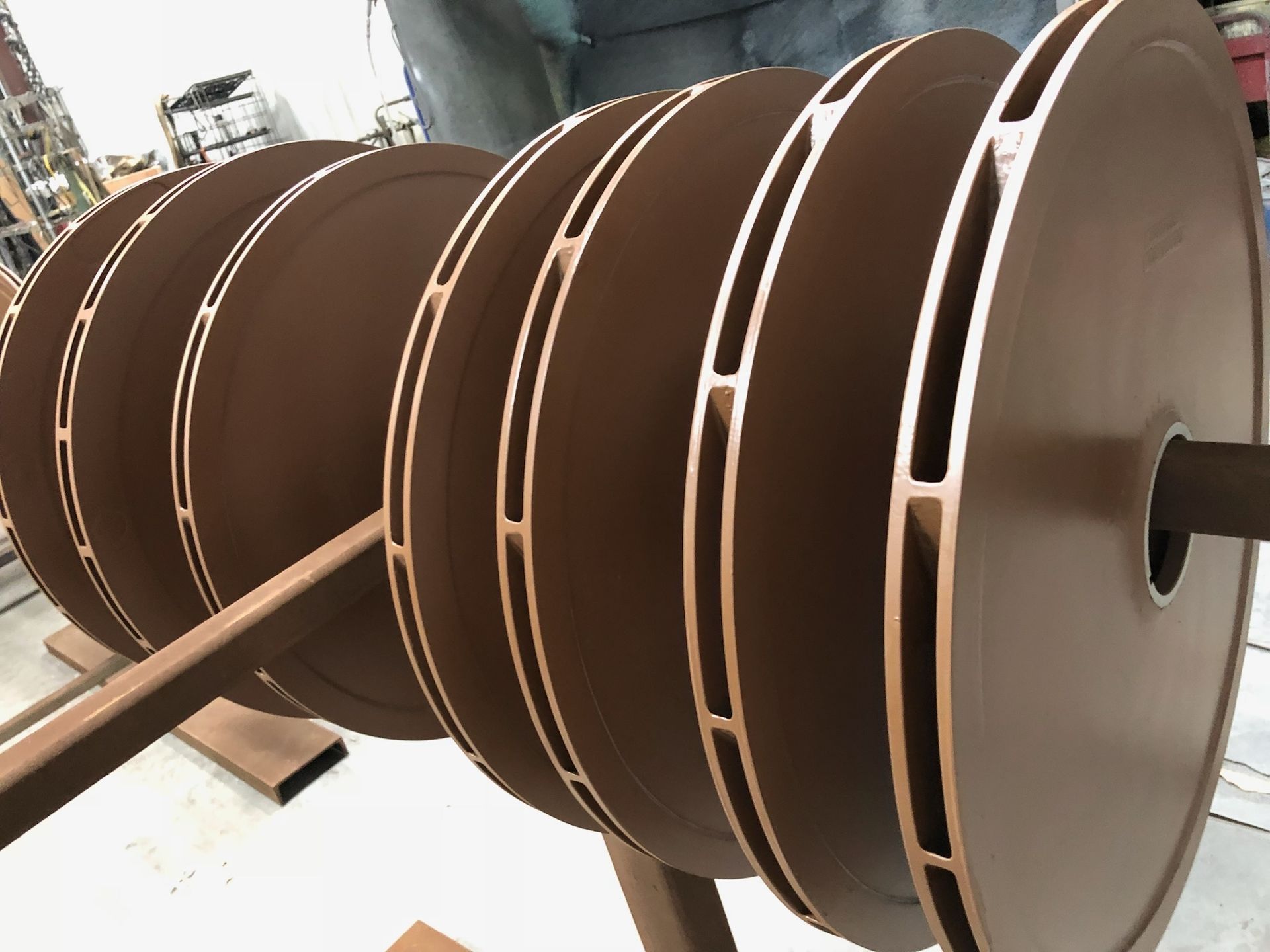 A close up of a spool of cardboard on a stand