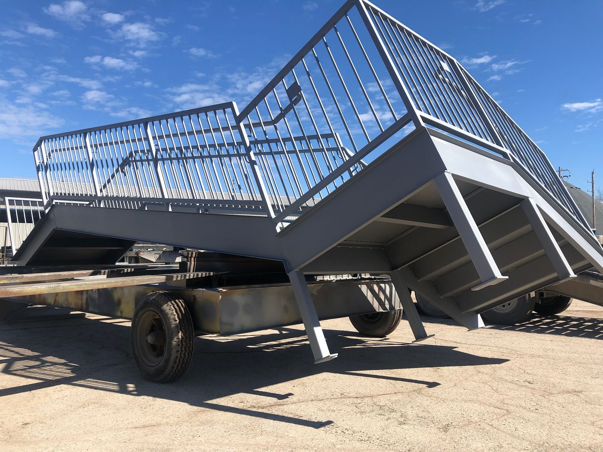 A metal staircase is sitting on top of a trailer.