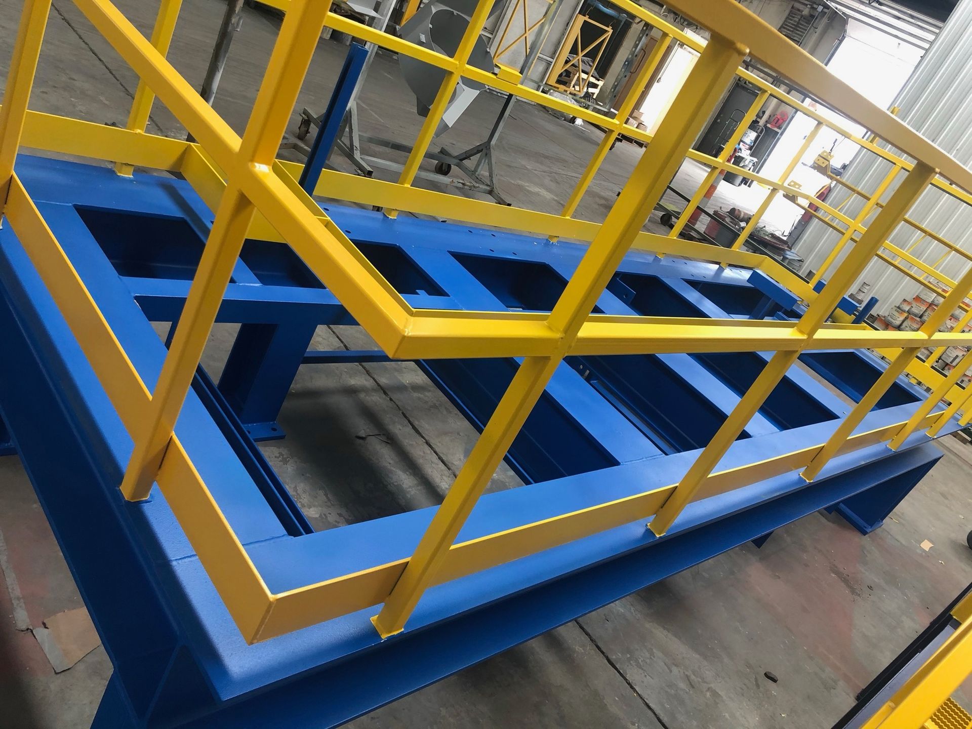 A blue and yellow metal structure