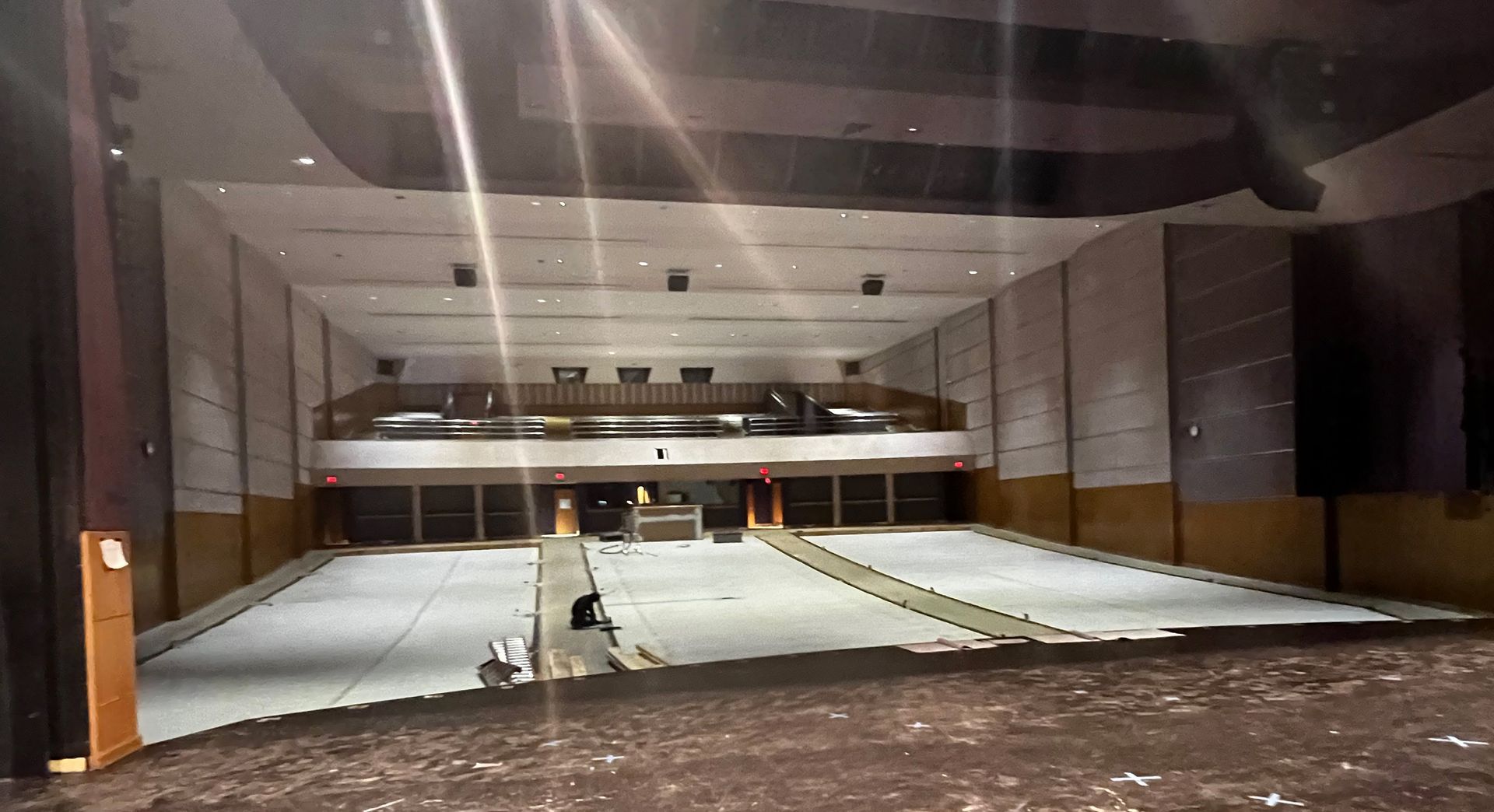 a large empty auditorium with a stage in the middle of it