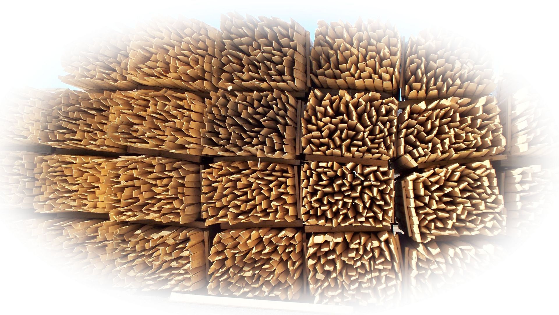 A pile of wooden blocks stacked on top of each other on a white background.
