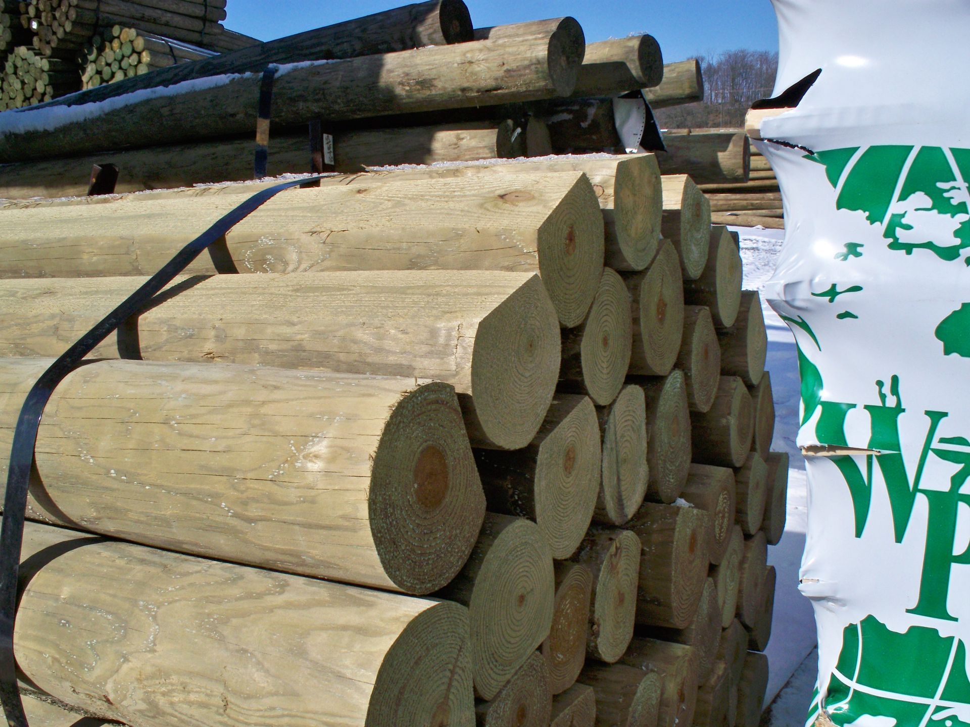 A bunch of logs are stacked on top of each other