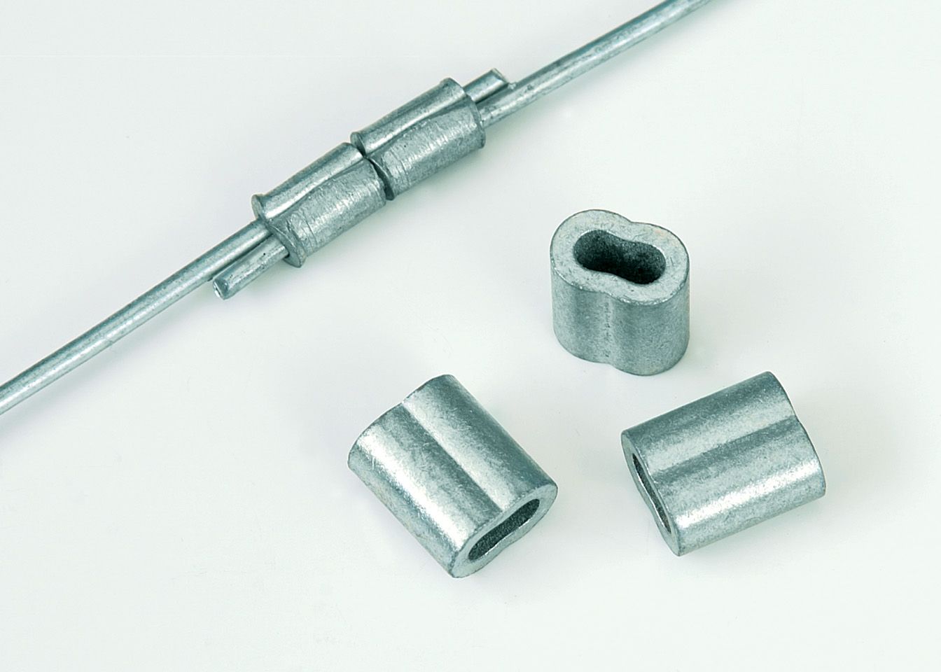 A close up of a metal pipe with a couple of spacers on it