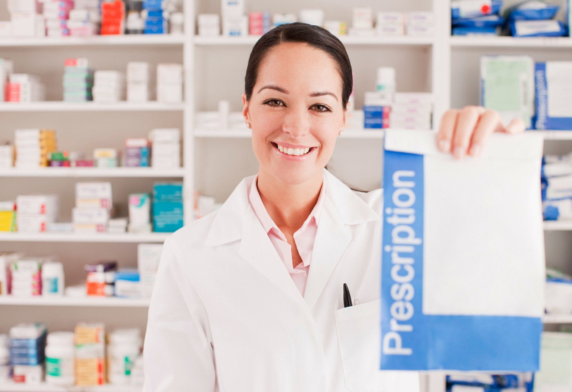 Pharmacist holding prescription