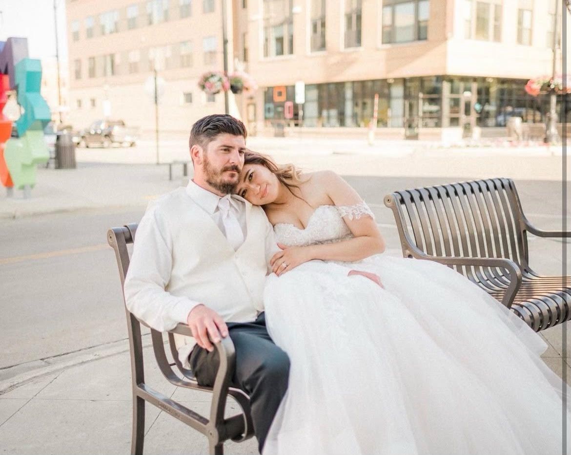 Bride and Groom sitting on the bench