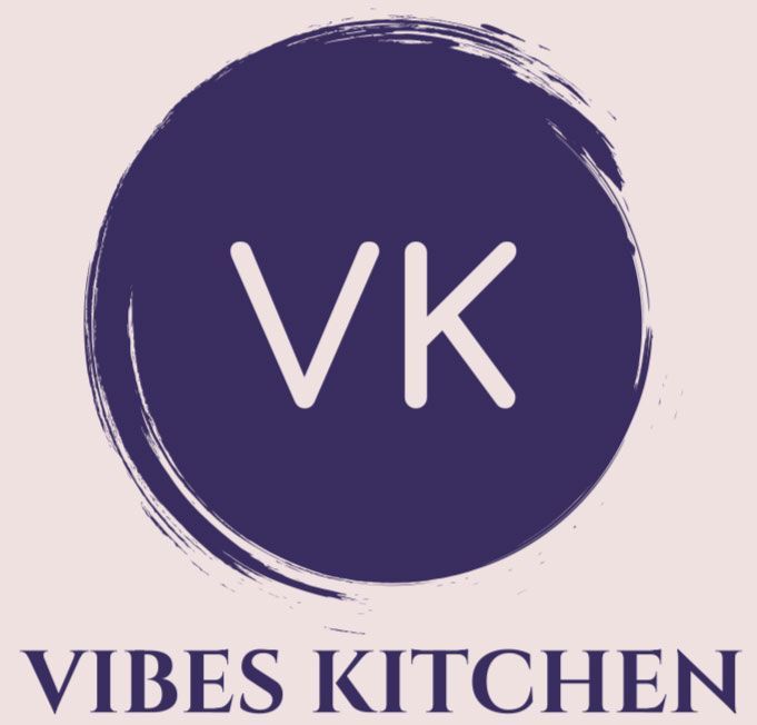 Logo for Vibes Kitchen: "VK" initials in white within a dark purple brushstroke circle; "Vibes Kitchen" text below.