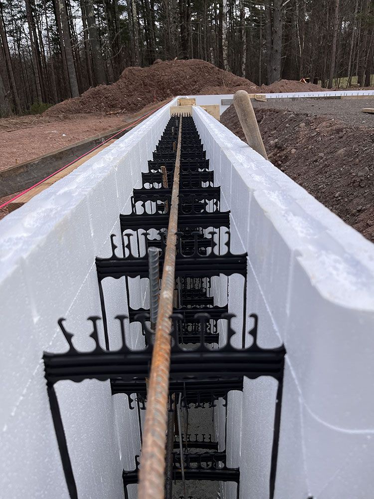A row of styrofoam blocks are being used to build a house.
