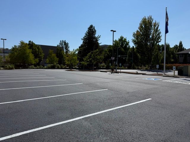 Empty parking lot with white painted lines