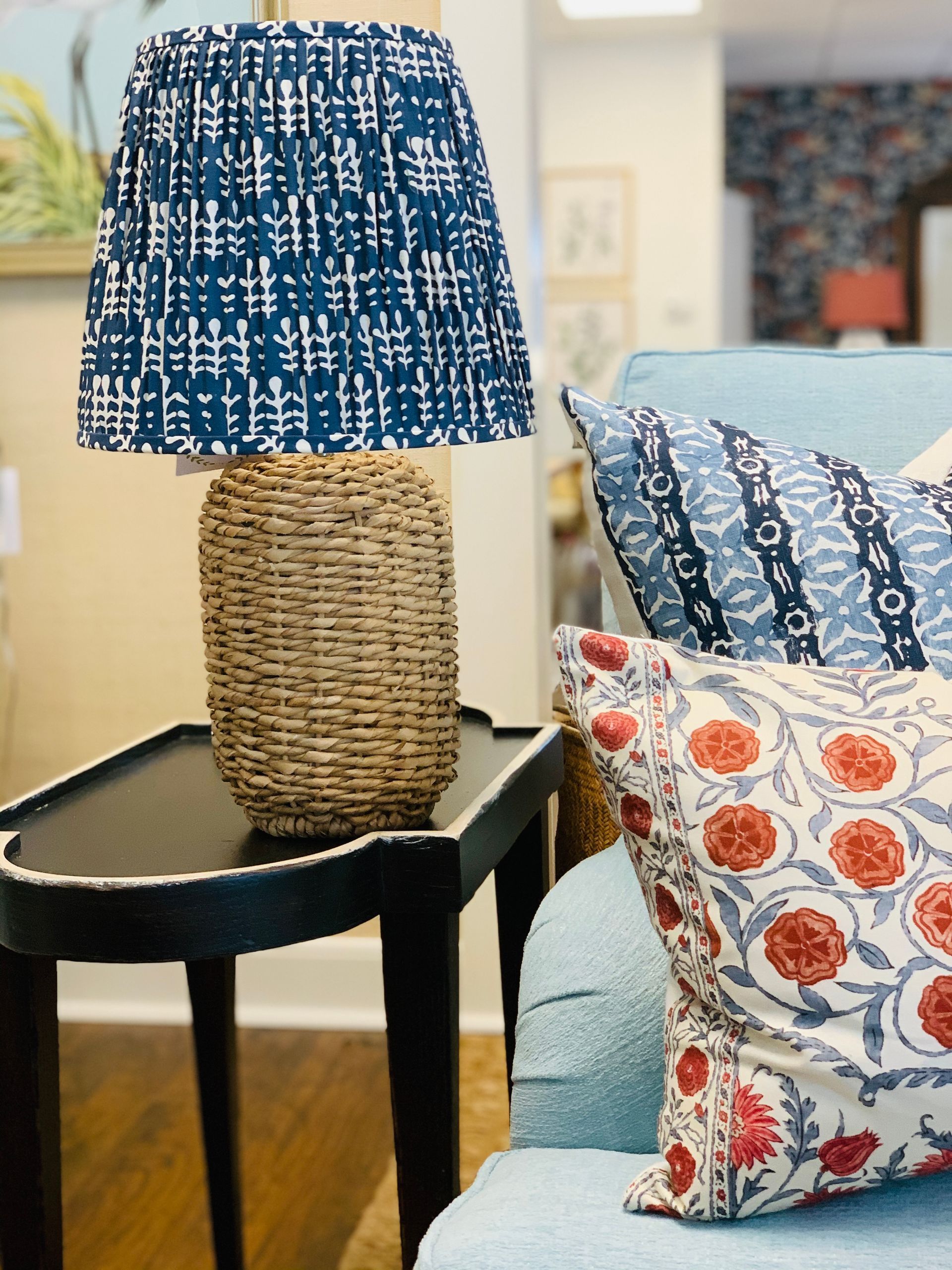 Various prints of pillows and lamp