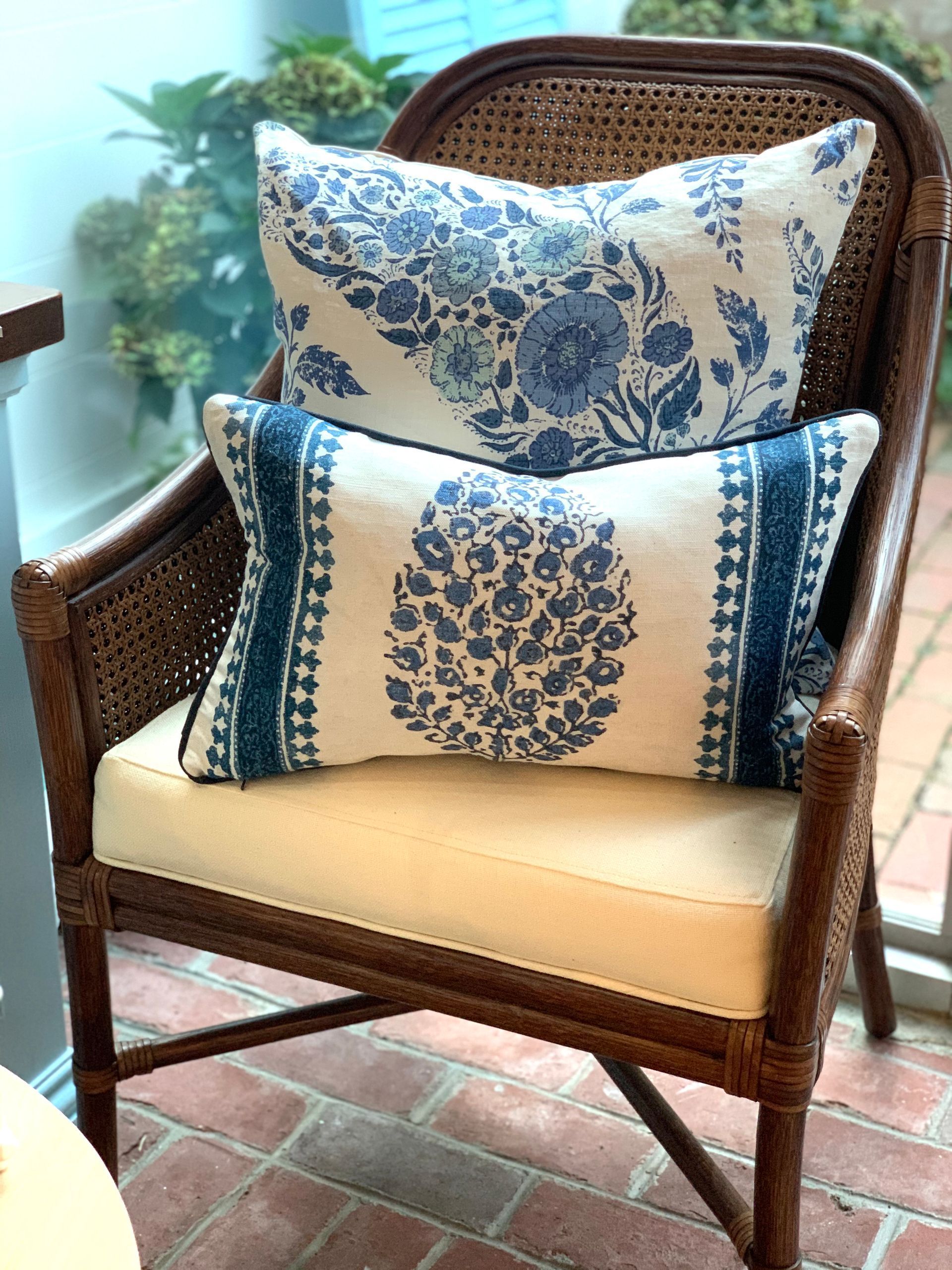 Rattan chair with pillows