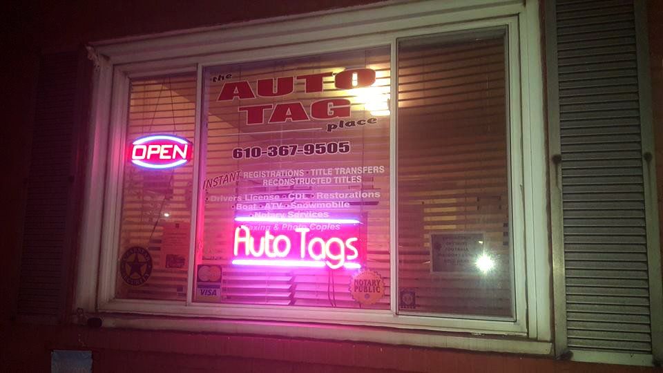 The Auto Tag Place signs
