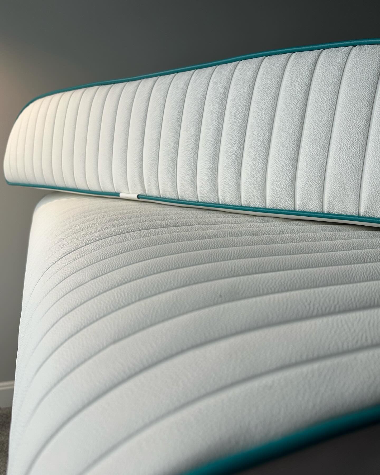 a mattress with a blue trim