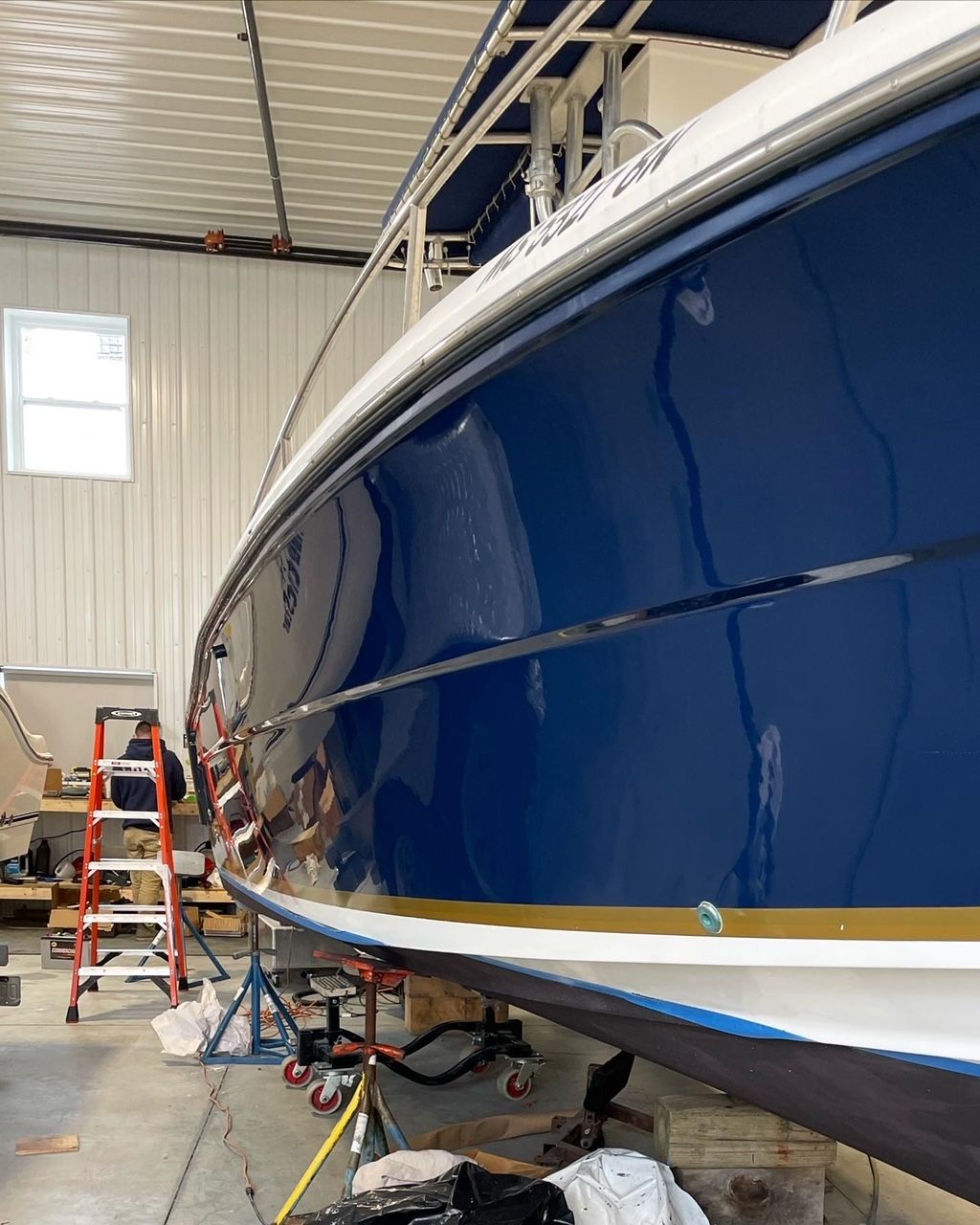 a blue boat in a garage