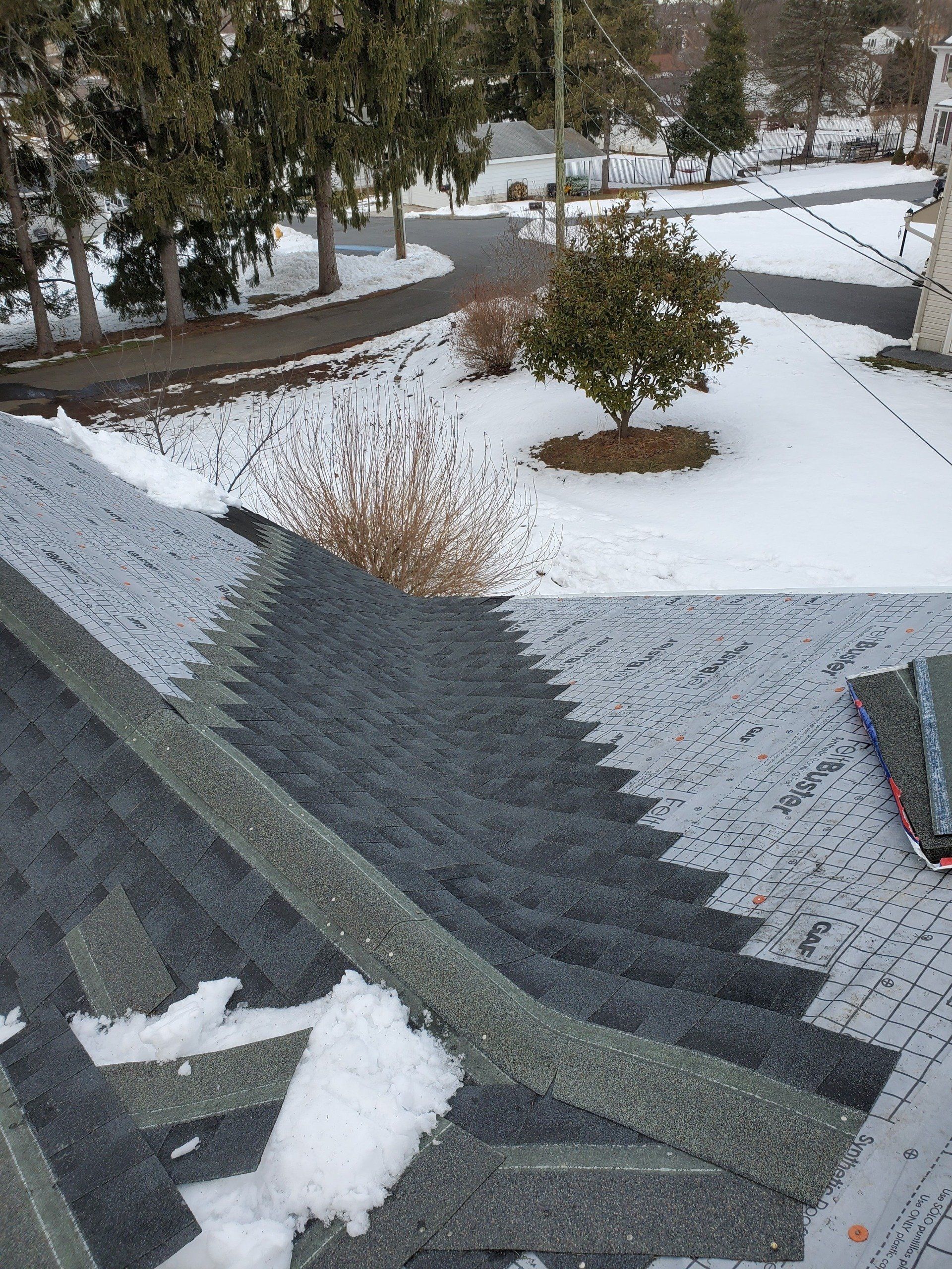 Roofing installation in a snow day