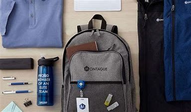 Backpack with branded items: shirt, pens, water bottle, jacket, and a laptop.