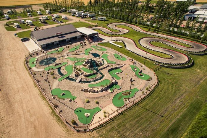 An aerial view of a mini golf course and a go kart track.