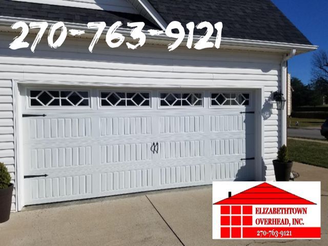 White double garage door with phone number 270-763-9121 and H. D. Hainline & Sons logo overlay.