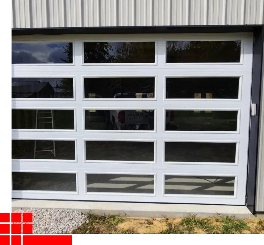 White garage door with horizontal glass panels and a concrete driveway in front