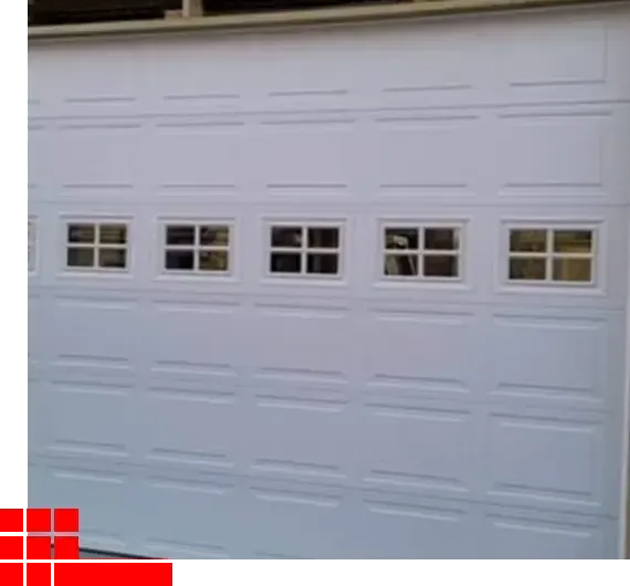 White garage door with four small window panels near the top.