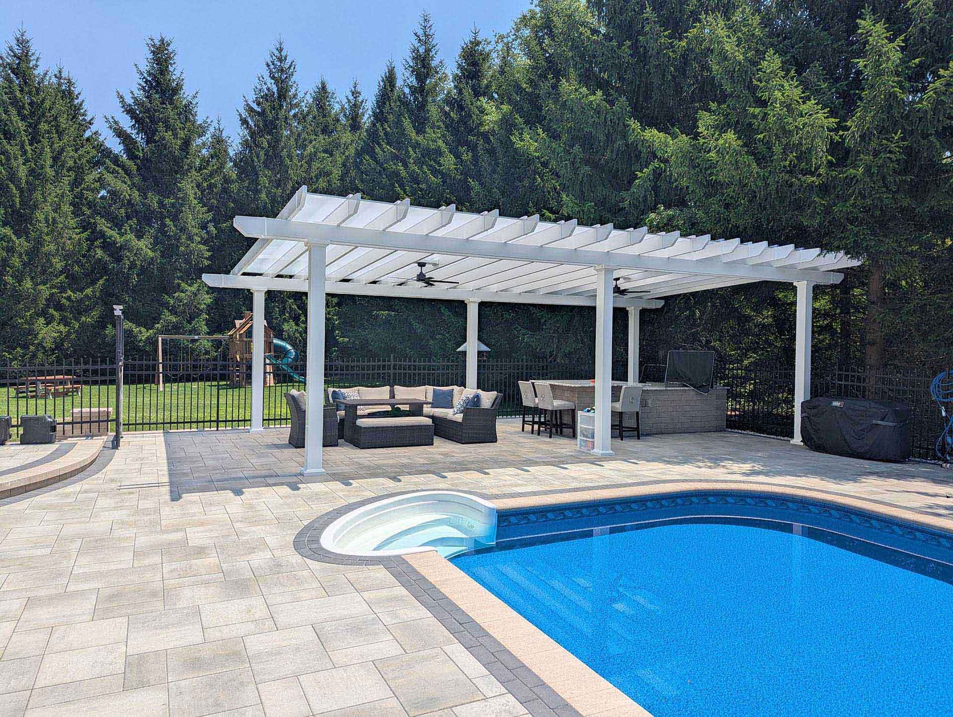 A pool near a white pergola