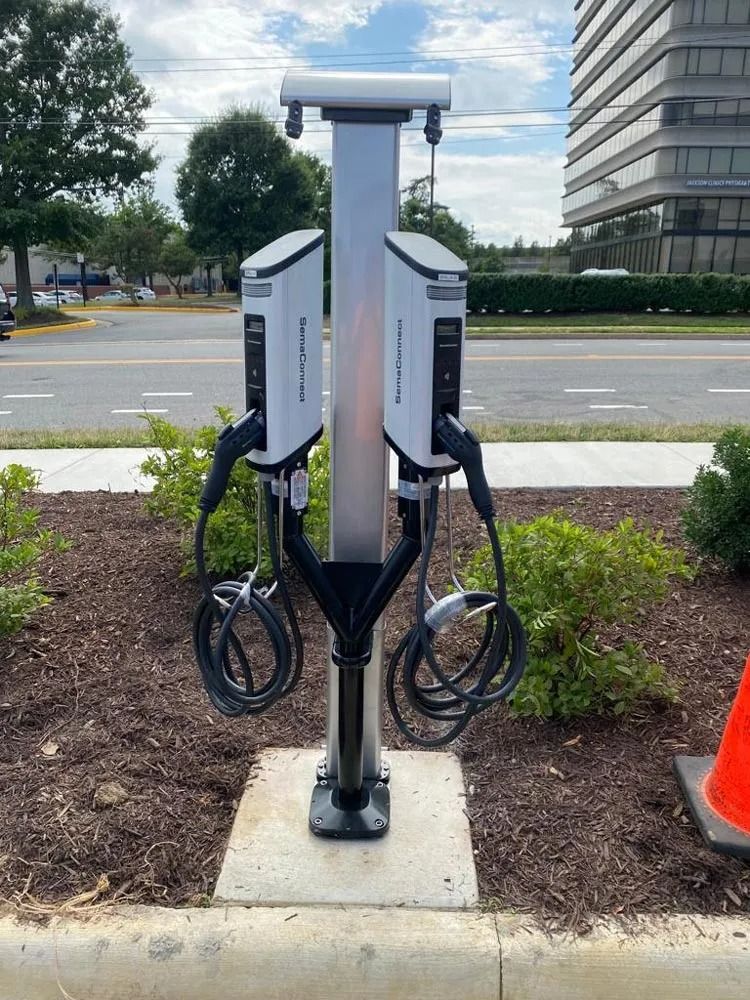 A person is working on an electrical panel.