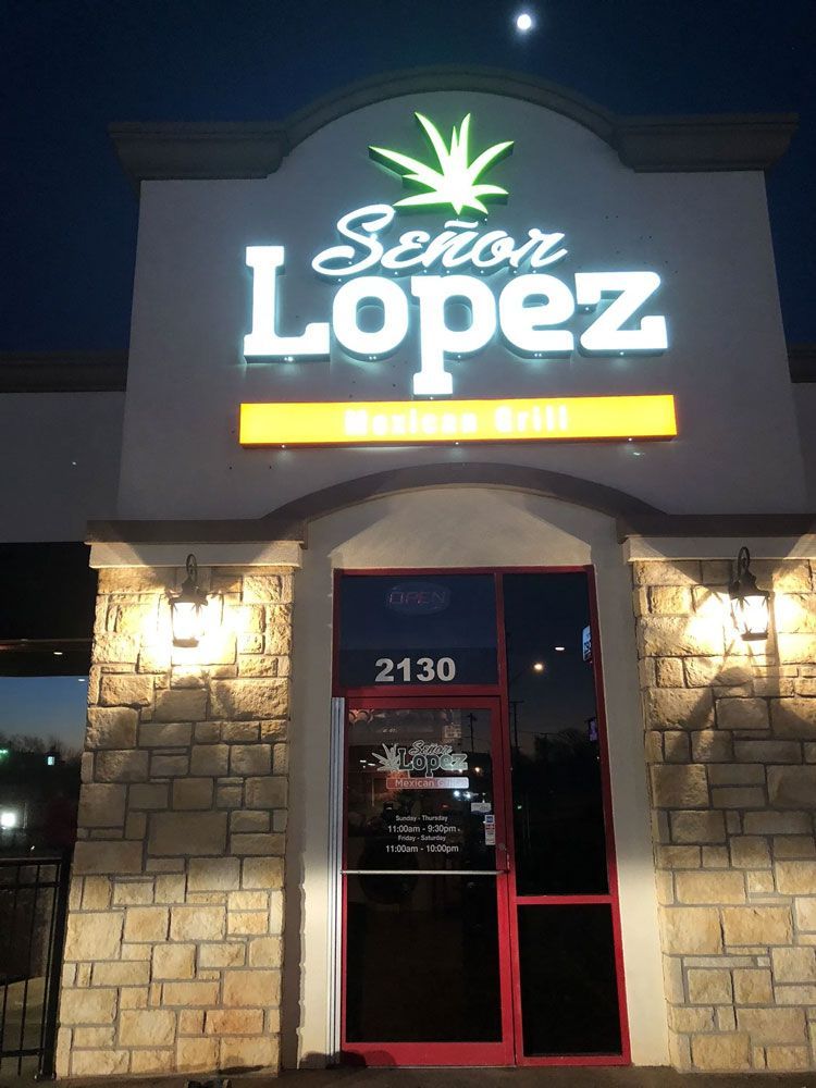 A señor lopez restaurant is lit up at night