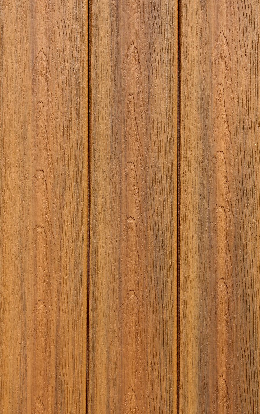 A close up of a piece of wood with a grainy texture.