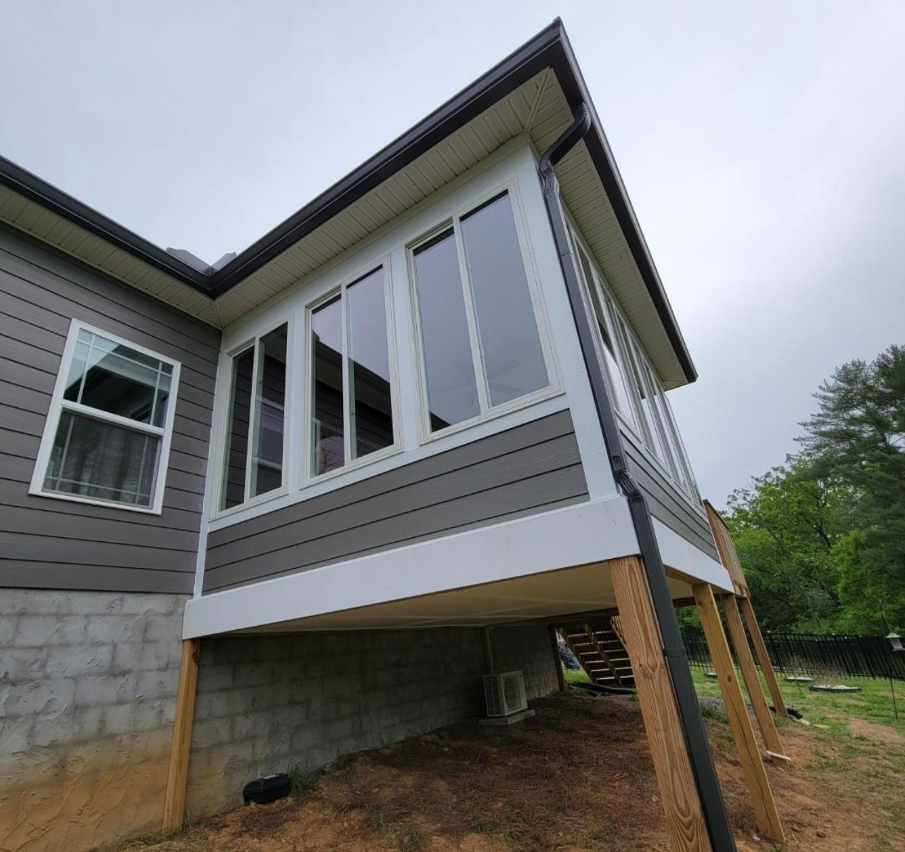 A house with a large window on the side of it